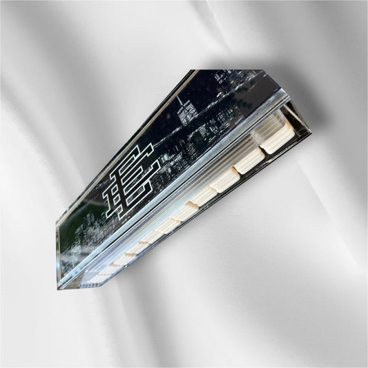 A rectangular LED light bar with a glossy black faceplate featuring stylized white Chinese characters, mounted on a white textured wall.
